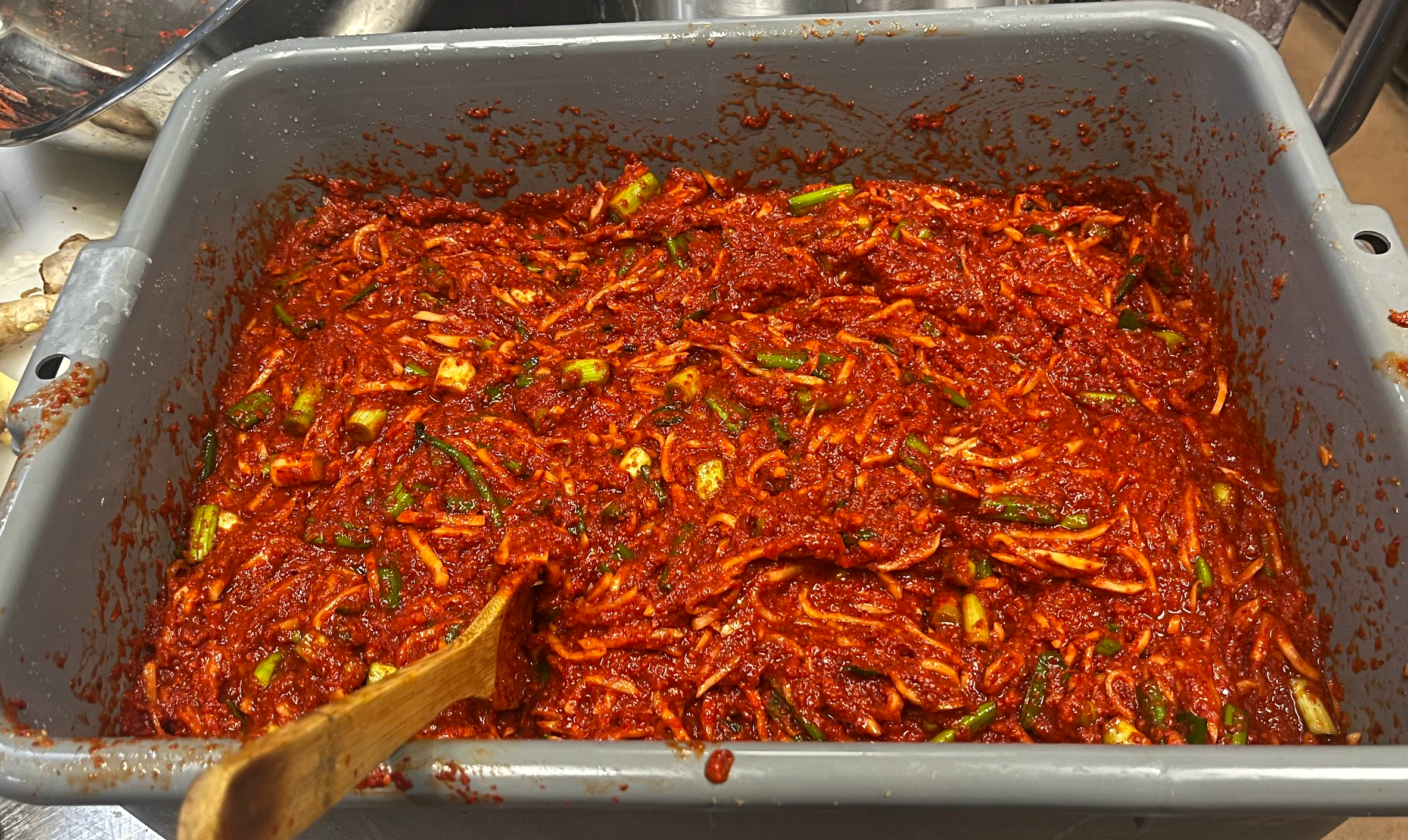 Freshly mixed yangnyeom — the traditional Korean kimchi seasoning paste that gives JinCha Kimchi its color, kick, and signature flavor